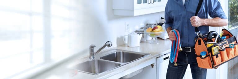 A home services pro with tools, illustrating the impact of a strong growth marketing plan.